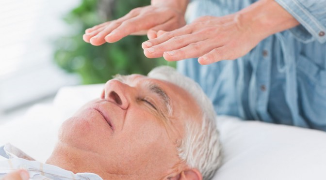 Hands above head of person with eyes closed